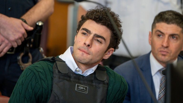 Luigi Mangione appears in court wearing vest